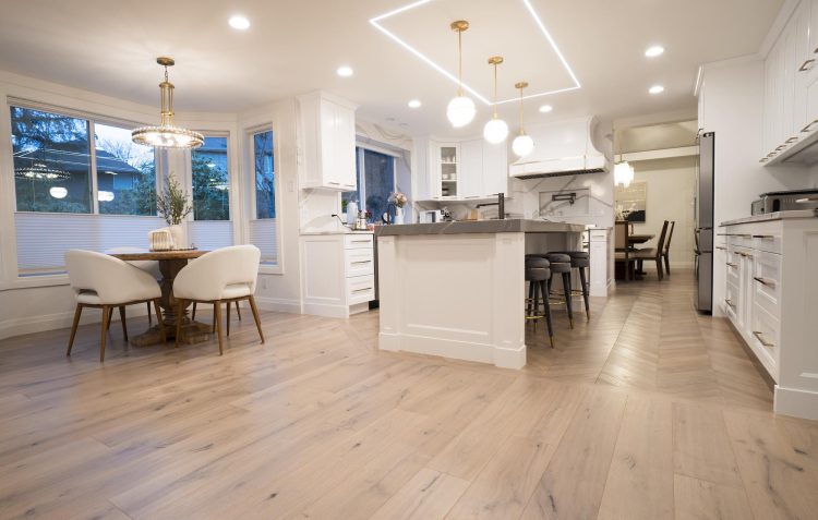 Engineered hardwood flooring installed in modern kitchen, showing natural wood grain and realistic finish